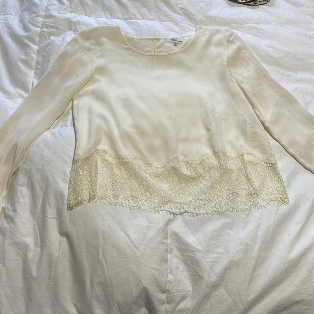 Aritzia long sleeve silk blouse with lace trim on bottom